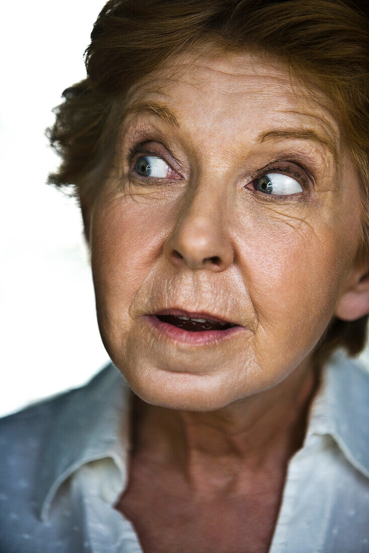 Senior woman displaying look of surprise