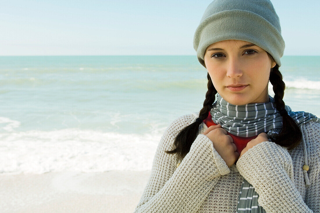 Teen girl at the beach on chilly day, portrait
