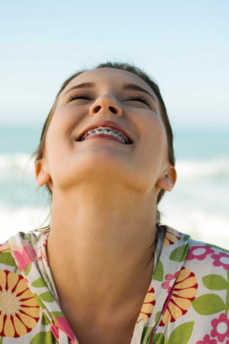 Teenage girl with head back and eyes closed, portrait