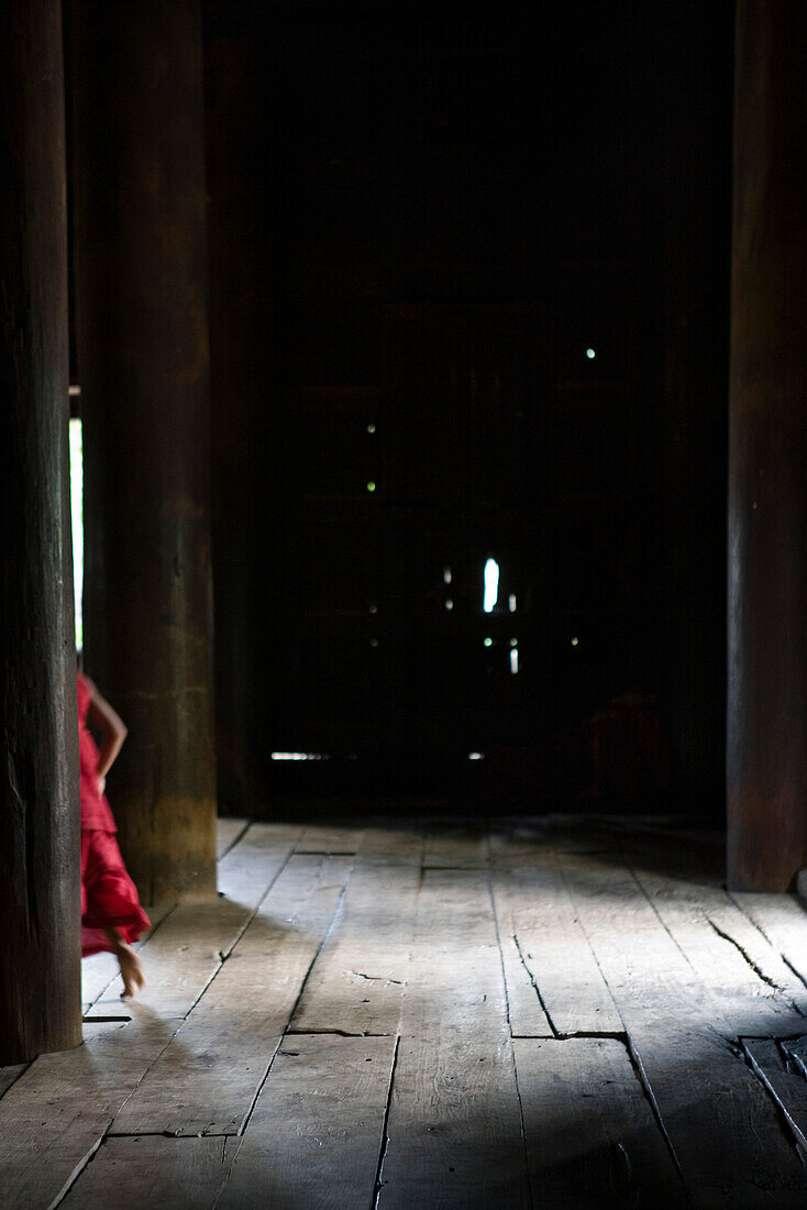 Bagaya Kyaung monastery, Inwa, Myanmar, monk walking, cropped