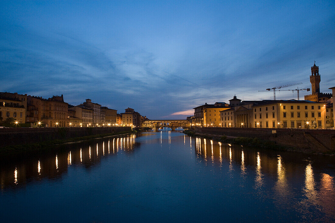 Florence, Italy, Arno river at night, Ponte Vecchio in the distance