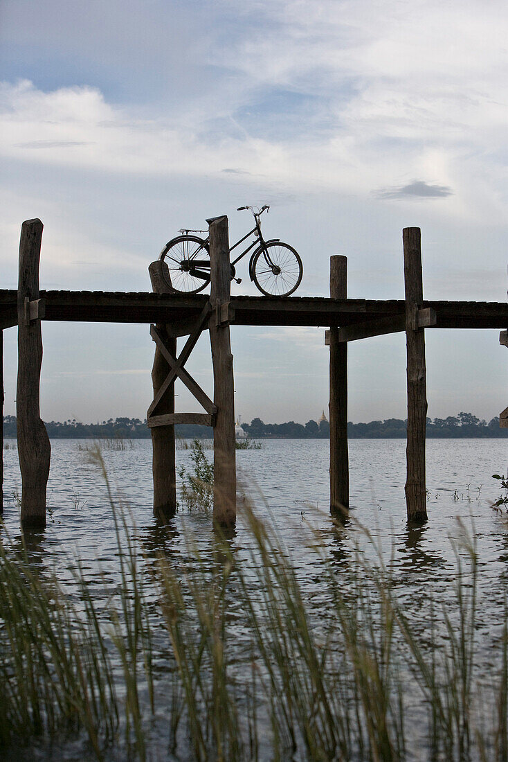 Amarapura, Myanmar, bicycle parked on U Bein Bridge