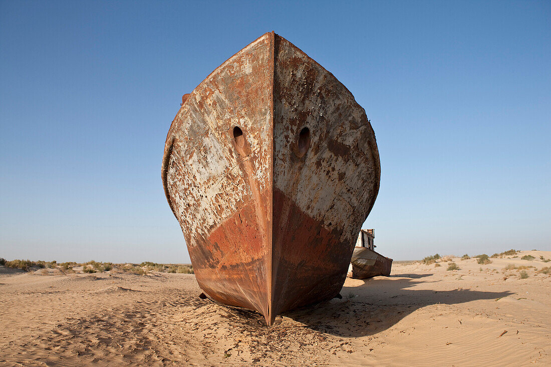 Uzbekistan, Moynaq, rusty boats beached in the desert which used to be the Aral Sea
