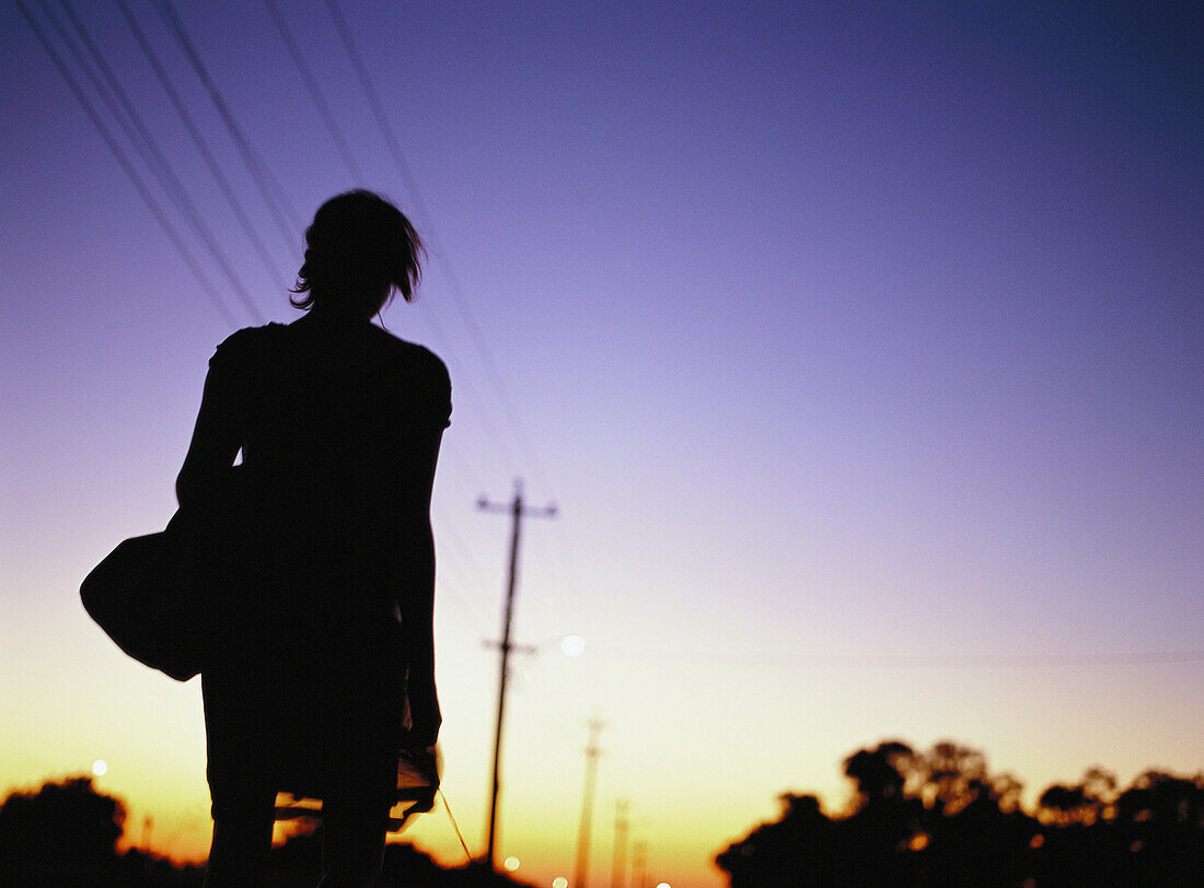 Silhouette of woman at twilight
