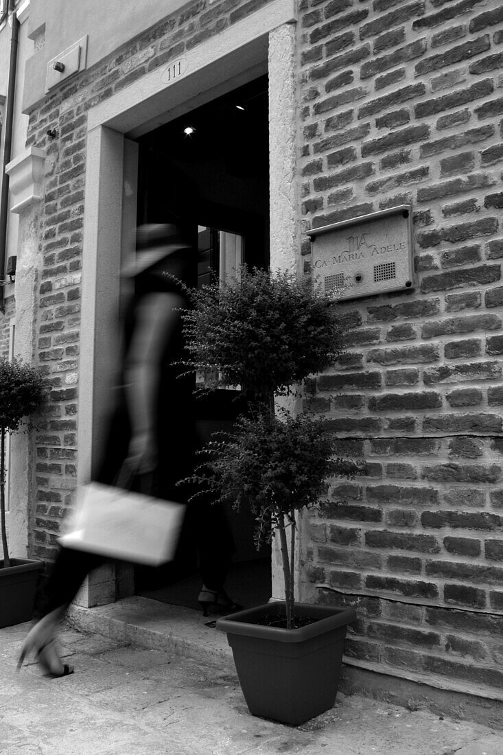 Woman entering hotel