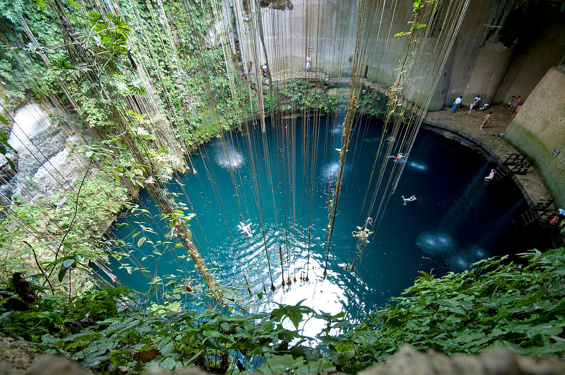 Mexico, Yucatan, Valladolid, swimming party in the Cenote Dzitnup (underground lake)