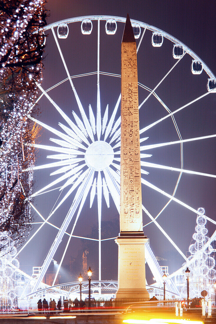 France, Paris, Concorde square, ferris wheel at night and obelisk