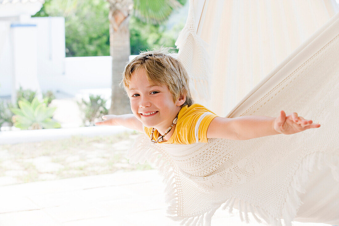 Boy playing in hammock