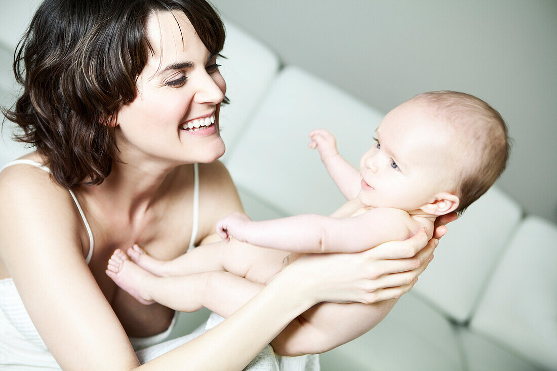 Mother playing with her baby