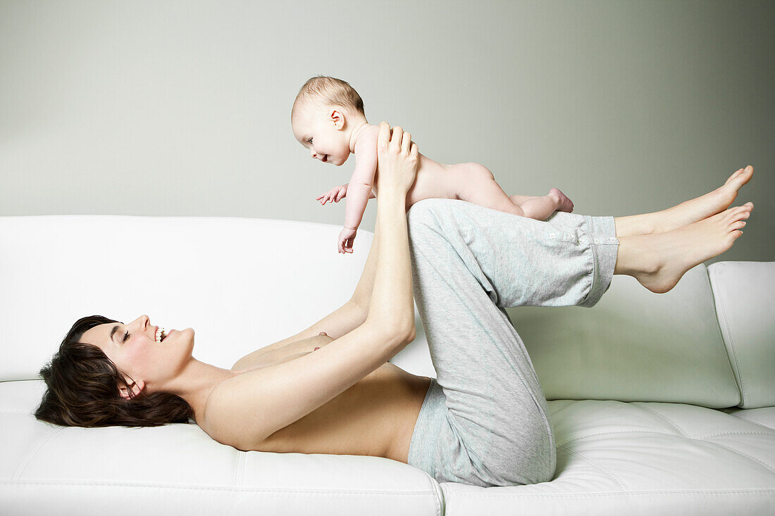 Mother playing with her baby