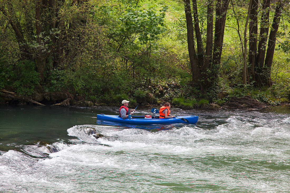 People canoeing at Wiesent valley, Fraenkische Schweiz, Franconia, Bavaria, Germany, Europe