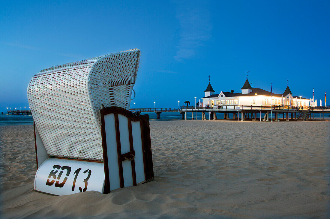 Beach chair and pier in the evening, Ahlbeck seaside resort, Usedom island, Baltic Sea, Mecklenburg-West Pomerania, Germany