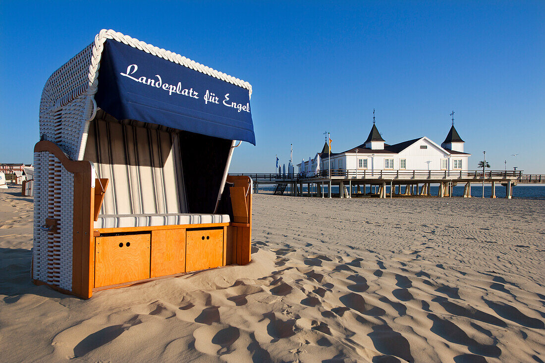 Beach chair and pier, Ahlbeck seaside resort, Usedom island, Baltic Sea, Mecklenburg-West Pomerania, Germany