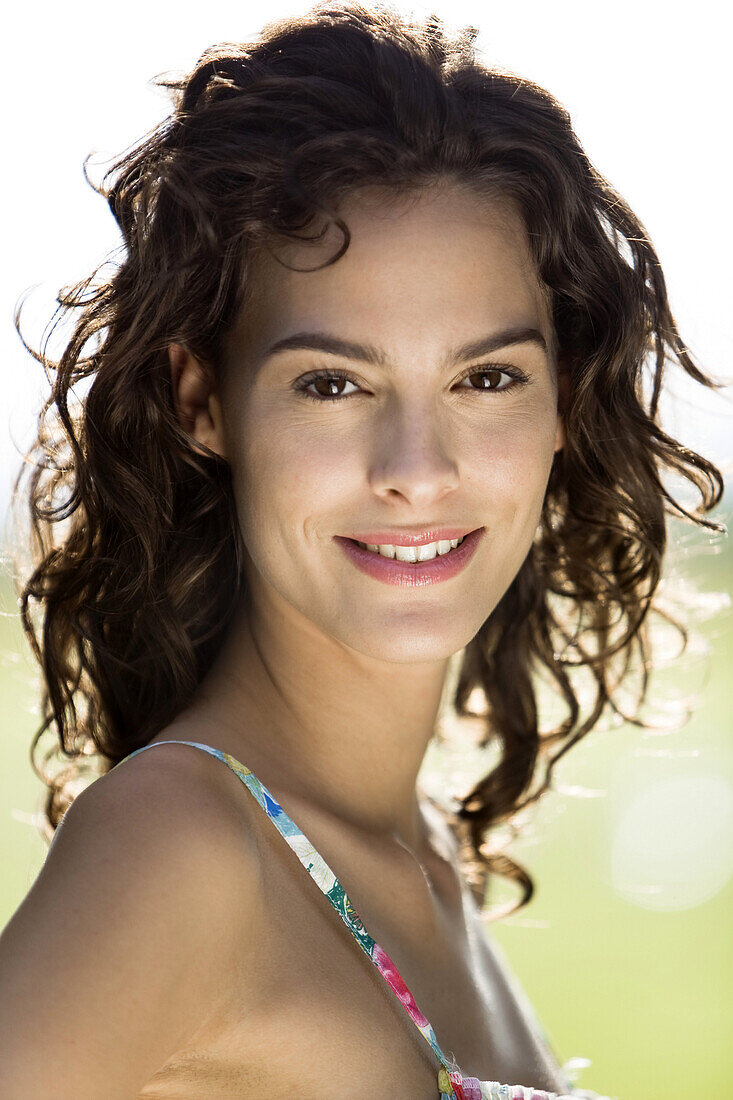 Portrait of young woman, smiling