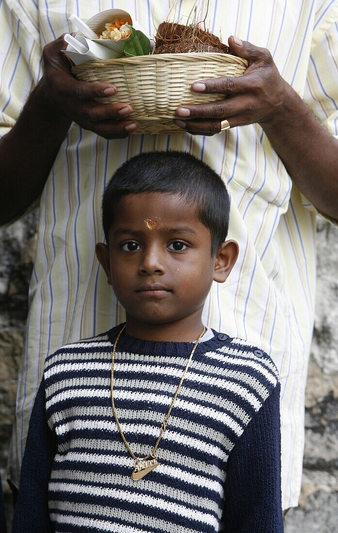 France, Paris, Boy and father at Ganesh festival