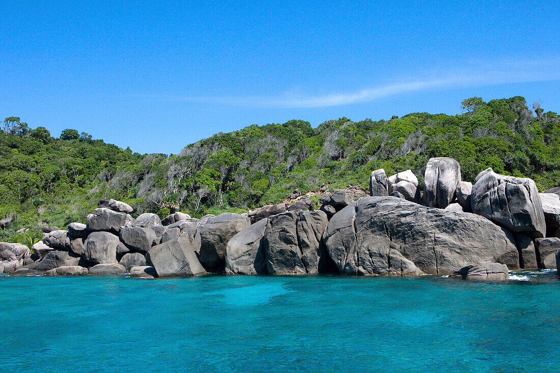 View onto rocks and rainforest on an island, Similan Islands, Andaman Sea, Thailand