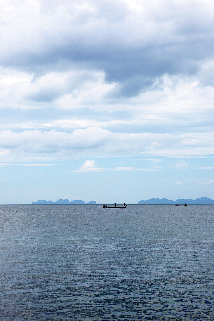 Fishermen on the coast of Koh Jum with view over to Koh Phi Phi, Koh Jum, Andaman Sea, Thailand