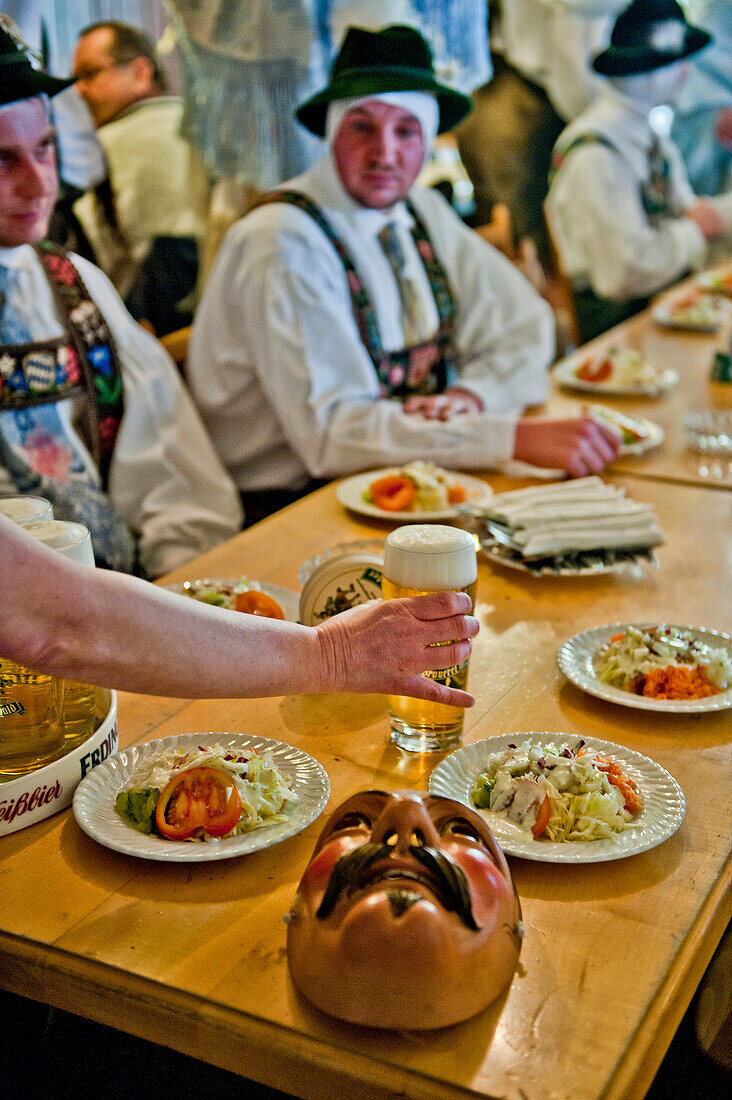 Disguised people at a restaurant, Mittenwald, Bavaria, Germany, Europe