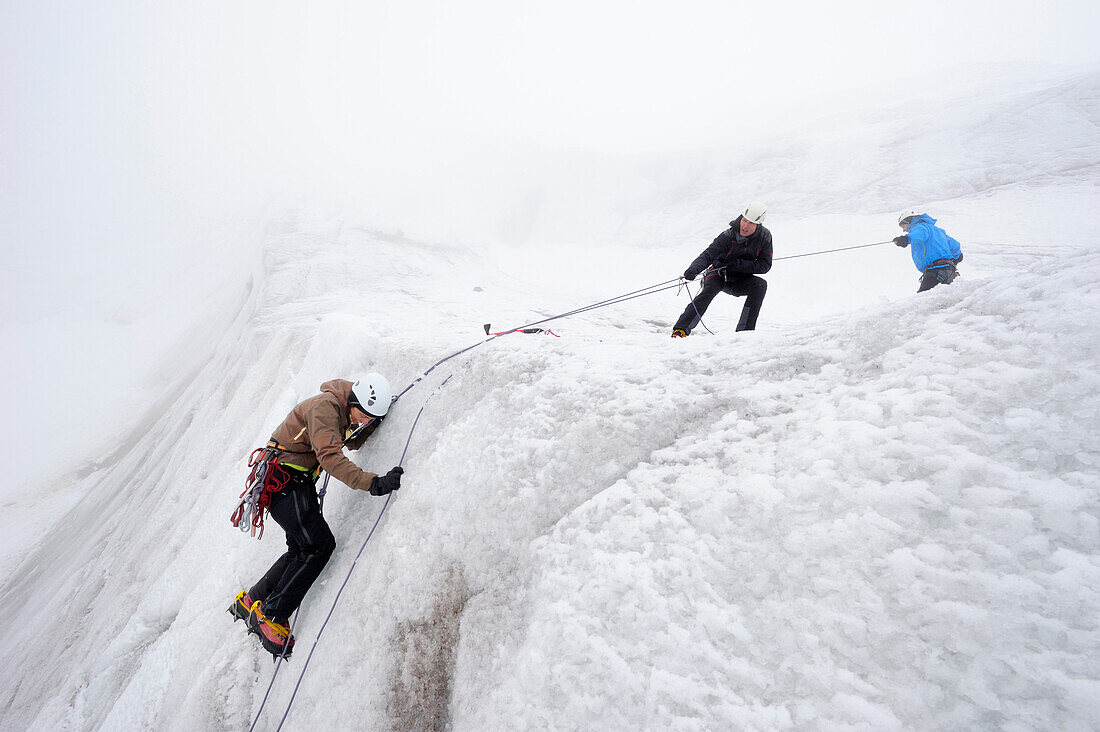 Crevasse rescue by a rope team, Taschachferner glacier, Oetztal Alps, Tyrol, Austria