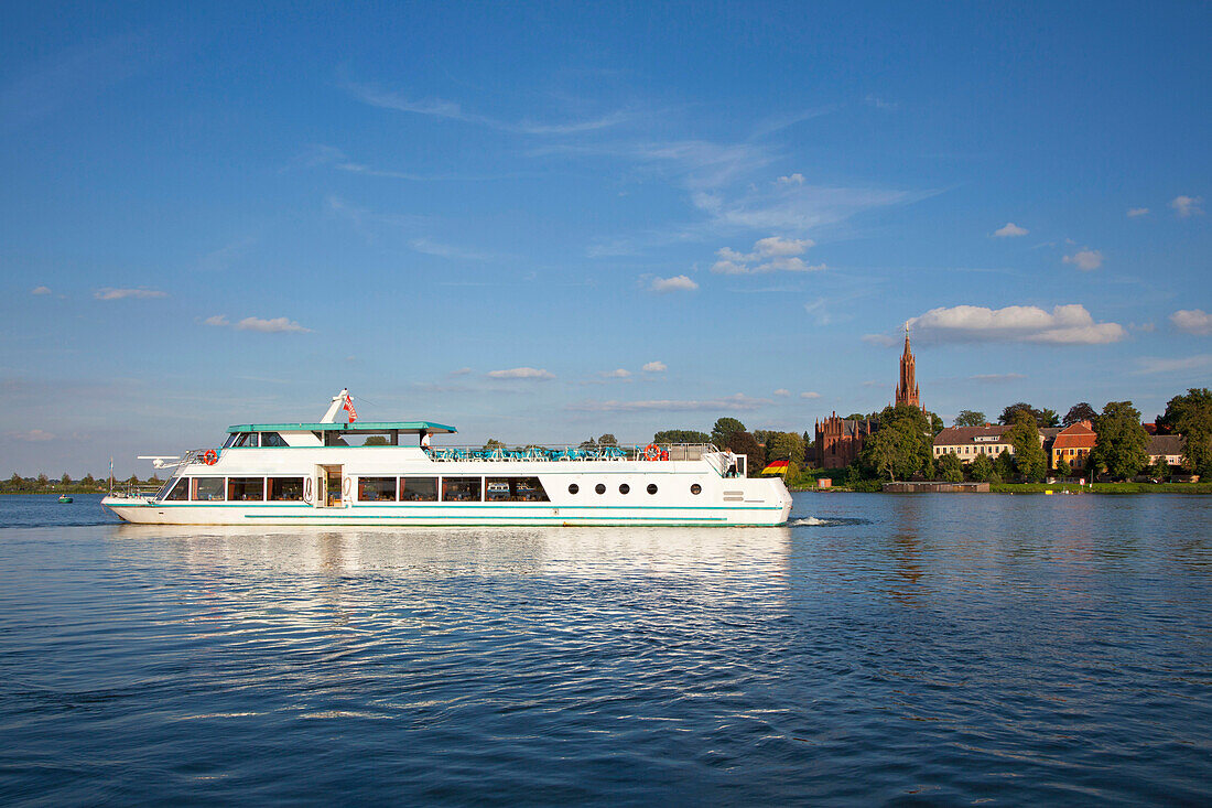 Excursion boat on Fleesensee lake in front of Malchow monastery, Mueritz-Elde-canal, Mecklenburg lake district, Mecklenburg Western-Pomerania, Germany, Europe