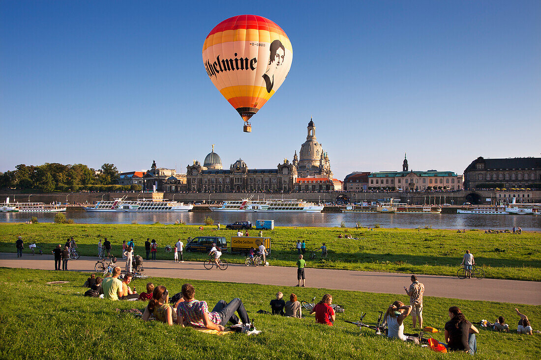 Balloons rising from the Elbe riverbank, Bruehlsche Terrasse and Frauenkirche in the background, Dresden, Saxonia, Germany, Europe