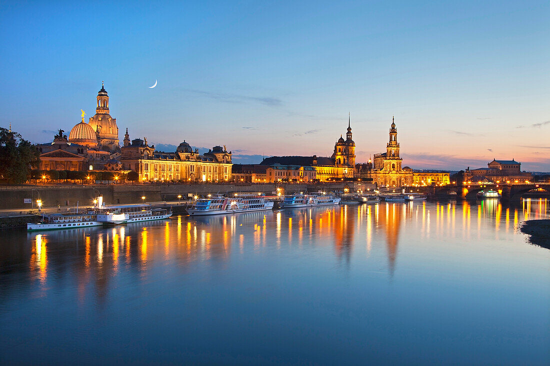 Panoramic view over the Elbe river to Bruehlsche Terrasse, University of visual arts, Frauenkirche, Staendehaus, Dresden castle, Hofkirche and Semper Opera in the evening, Dresden, Saxonia, Germany, Europe