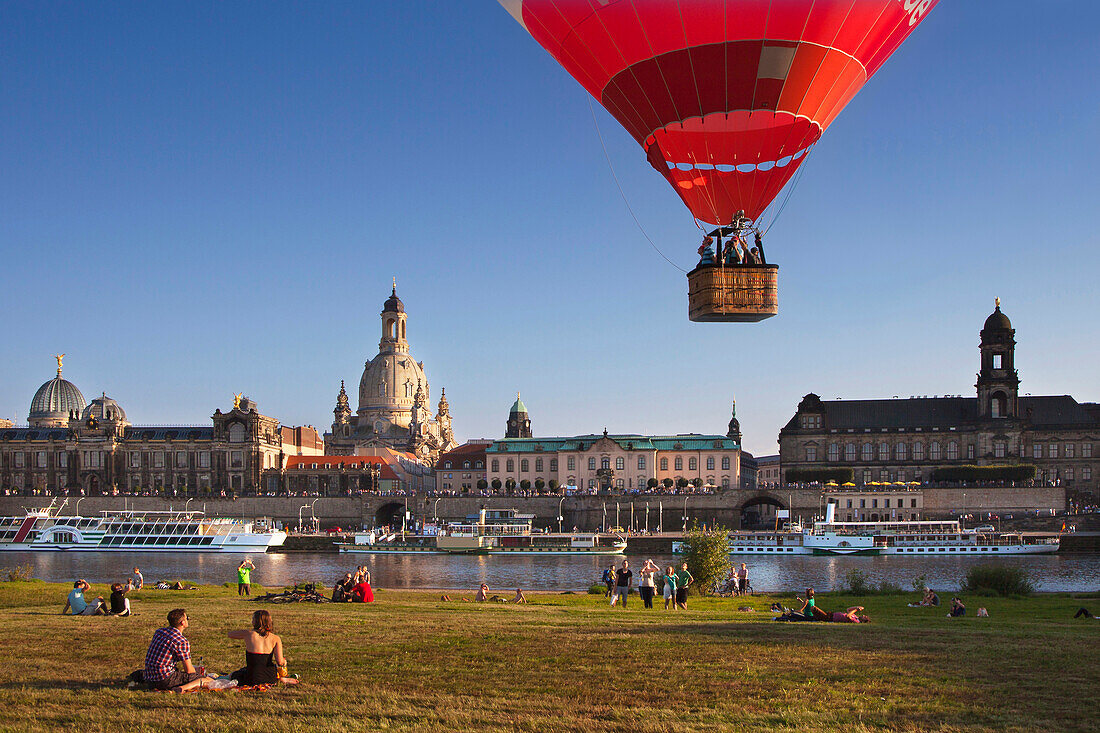 Balloons rising from the Elbe riverbank, Bruehlsche Terrasse and Frauenkirche in the background, Dresden, Saxonia, Germany, Europe