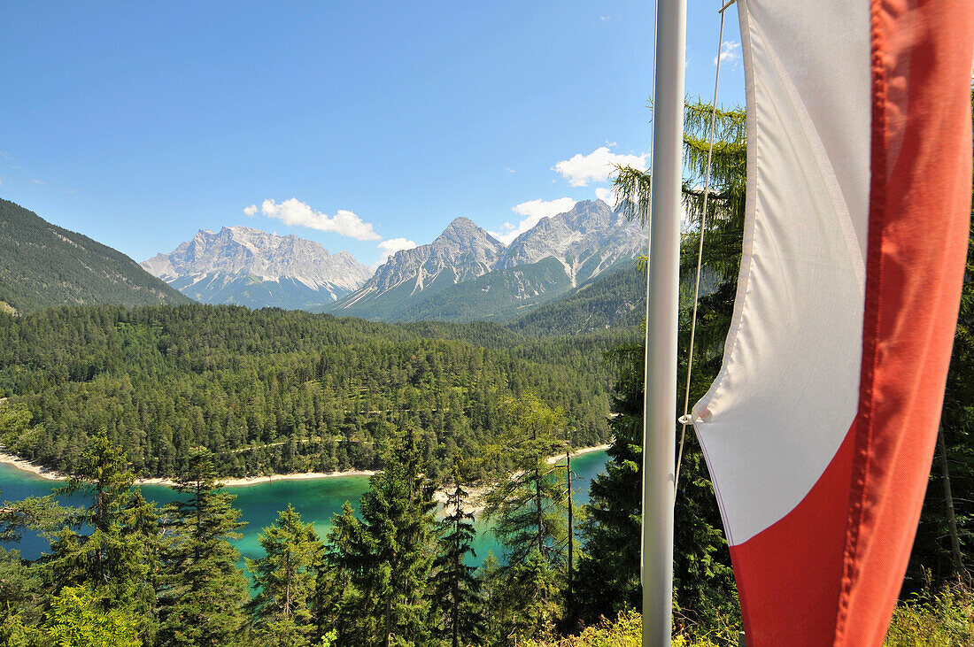 Flag at Fernpass with lake Blind, Zugspitze and Sonnenspitze, Zugspitz area, Tyrol, Austria, Europe