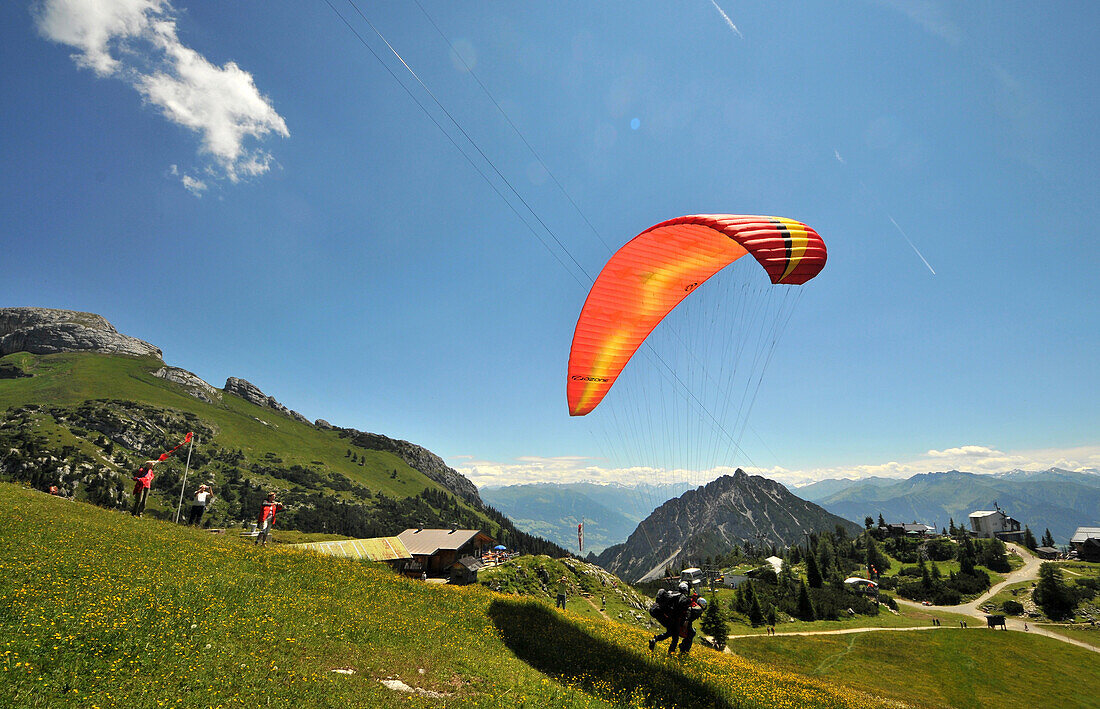 Paraglider at the Erfurter hut in the Rofan range over Maurach, lake Achensee, Tyrol, Austria, Europe