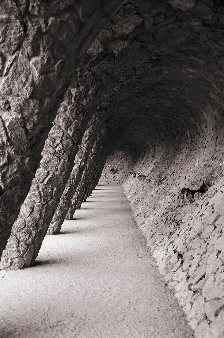 Sculptural columns and arched walkway in Park Guell, Barcelona, Spain