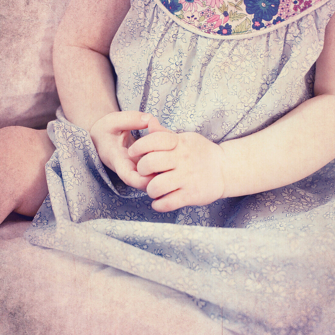 Baby girl's arms, cropped