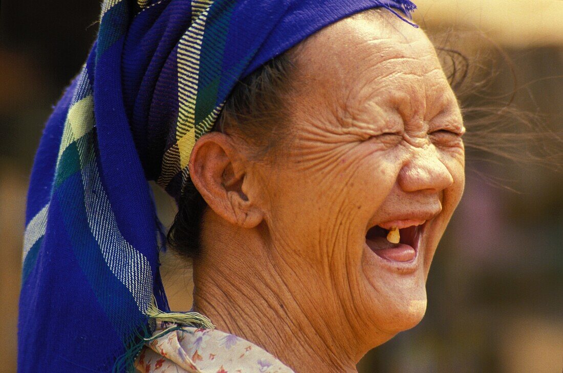 Laos, Luang Prabang, Laughing Hmong woman