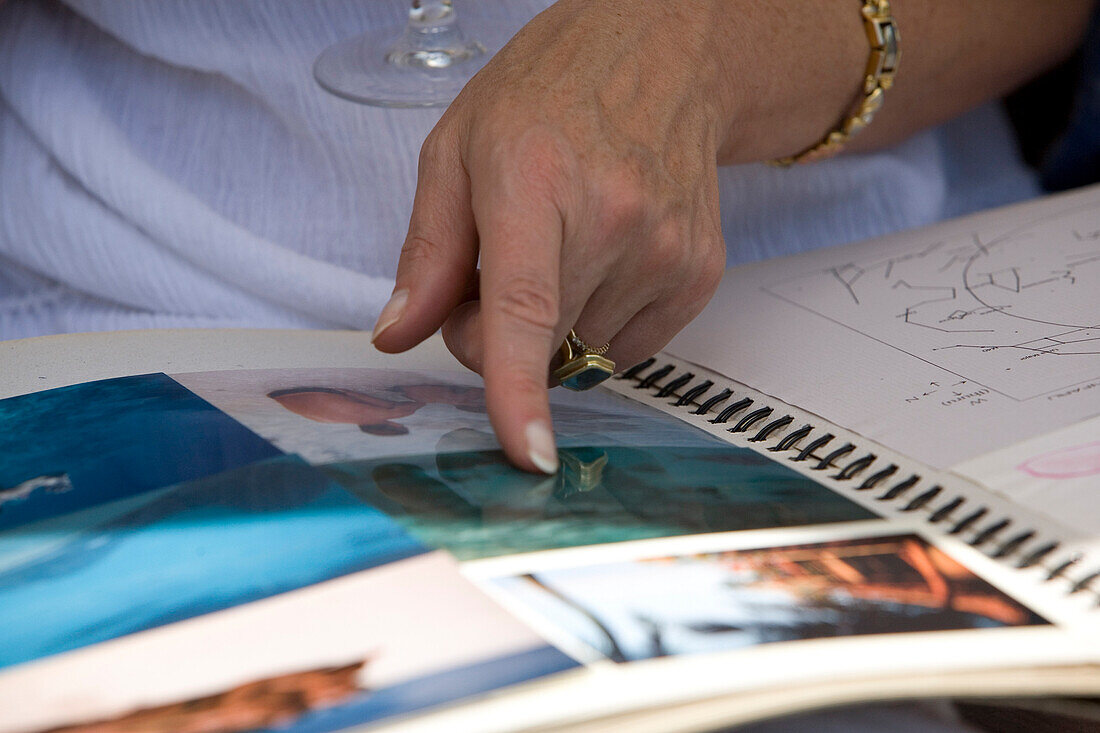 Woman looking at pictures in a book