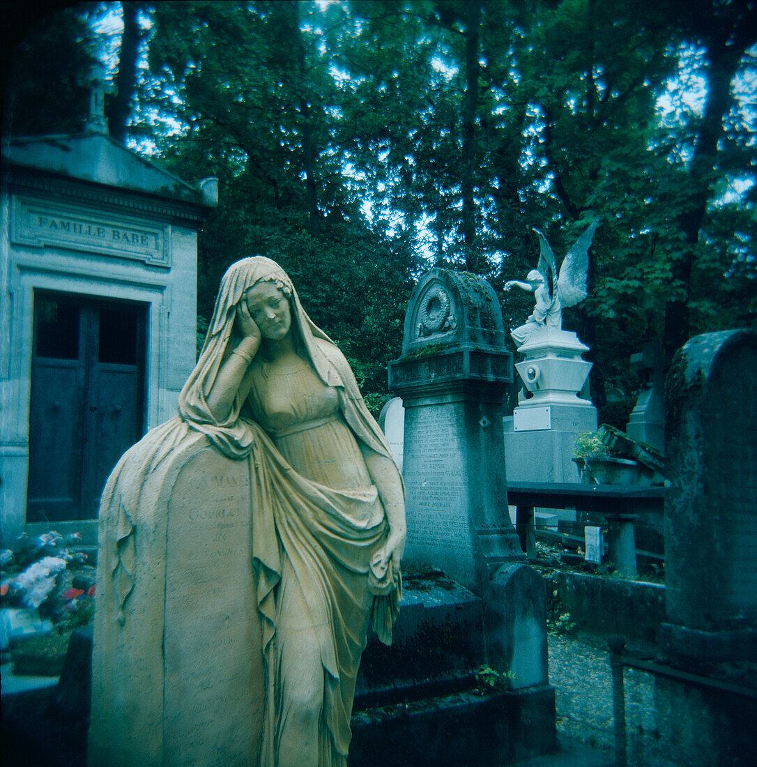 Statues in Cemetery, Paris, France