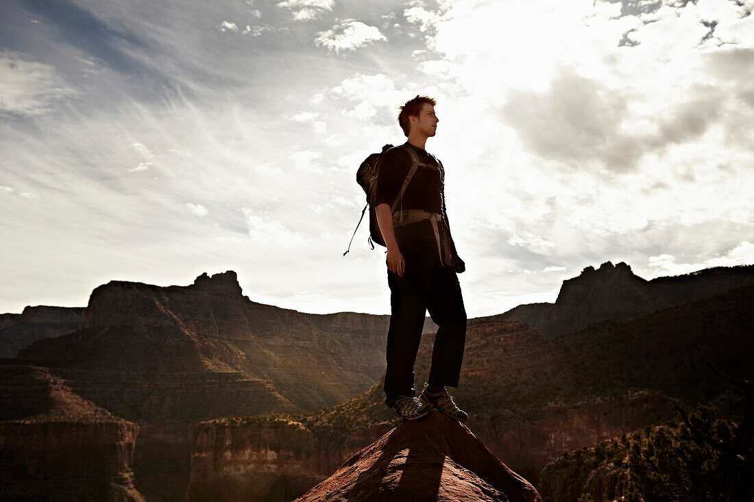 Man Standing on Top of Rock, Grand Canyon, Arizona, USA