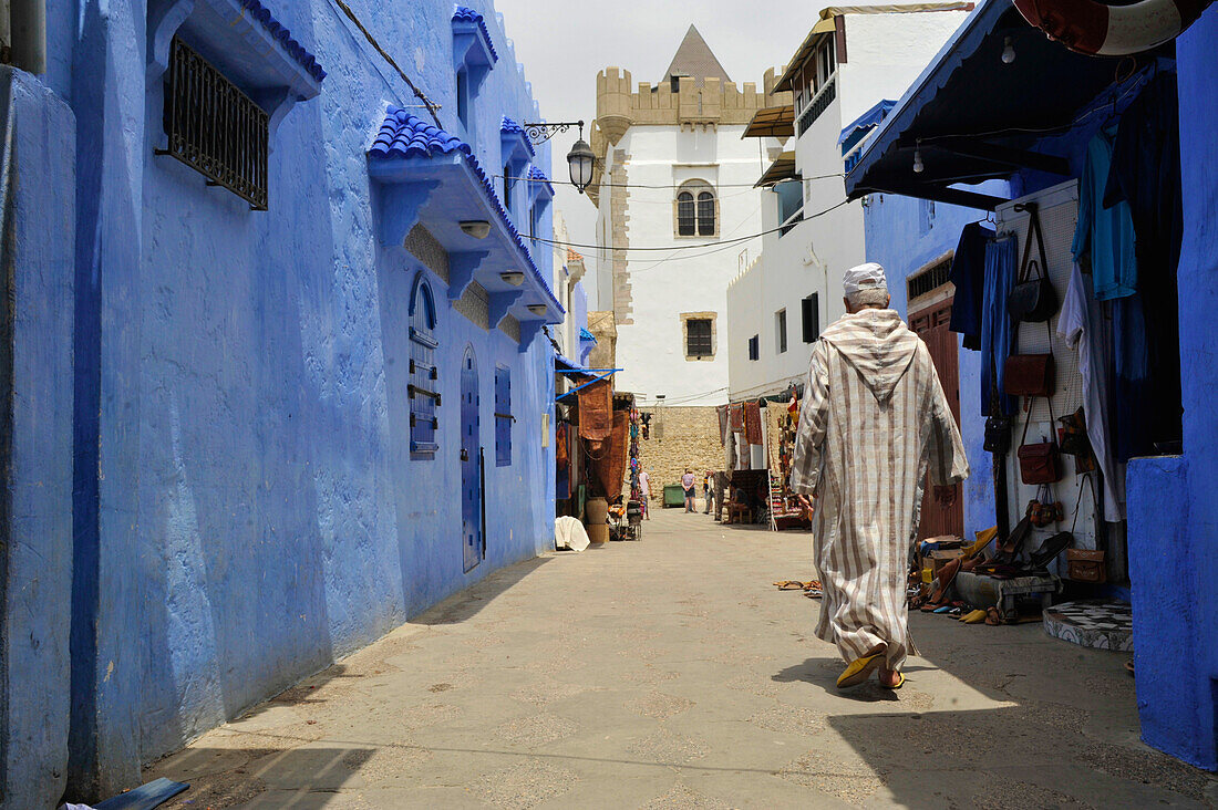 Man in traditional dress in the old town of Asilah, Atlantic Coast, Morocco, Africa