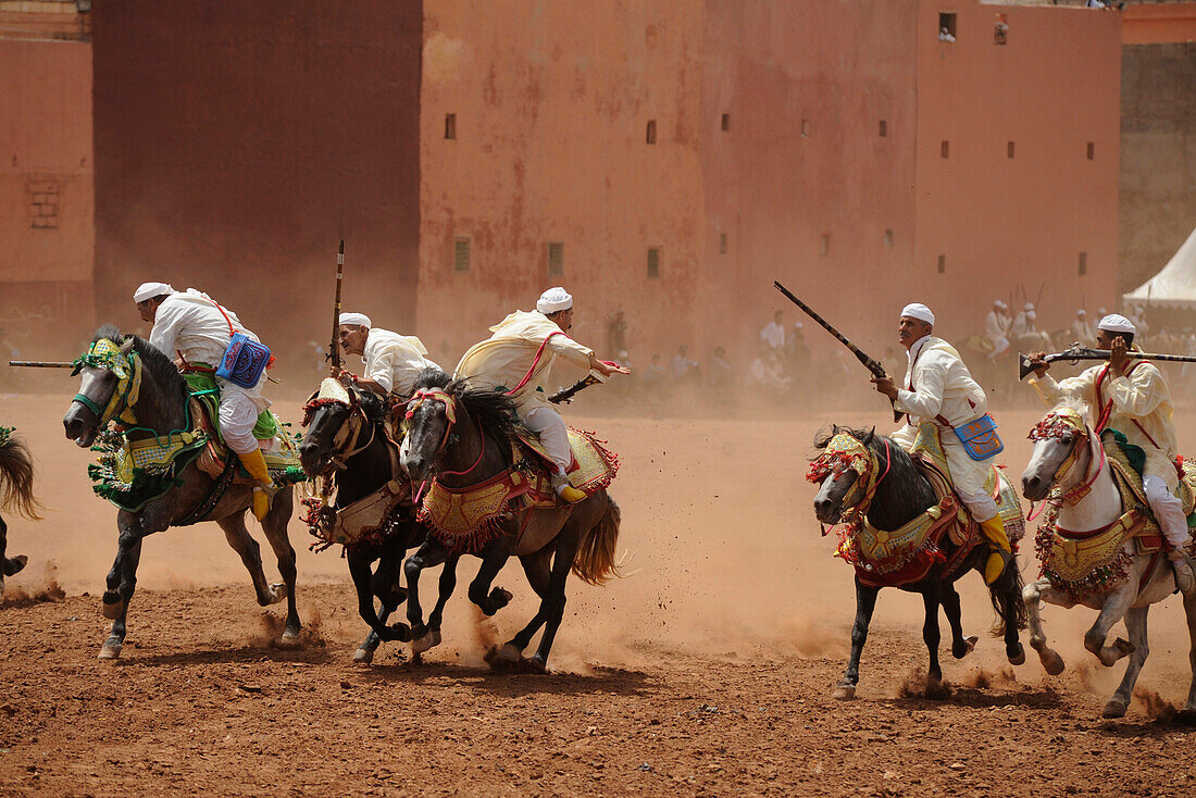 Men on horseback carrying guns, Fantasia festival for the Moussem at Azilal, High Atlas, Morocco, Africa