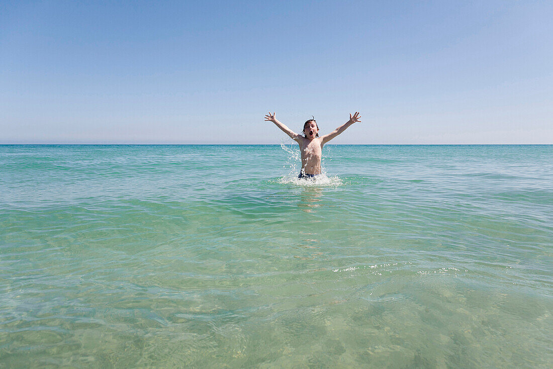 Boy bathing in Atlantic Ocean, Costa Calma, Fuerteventura, Canary Islands, Spain