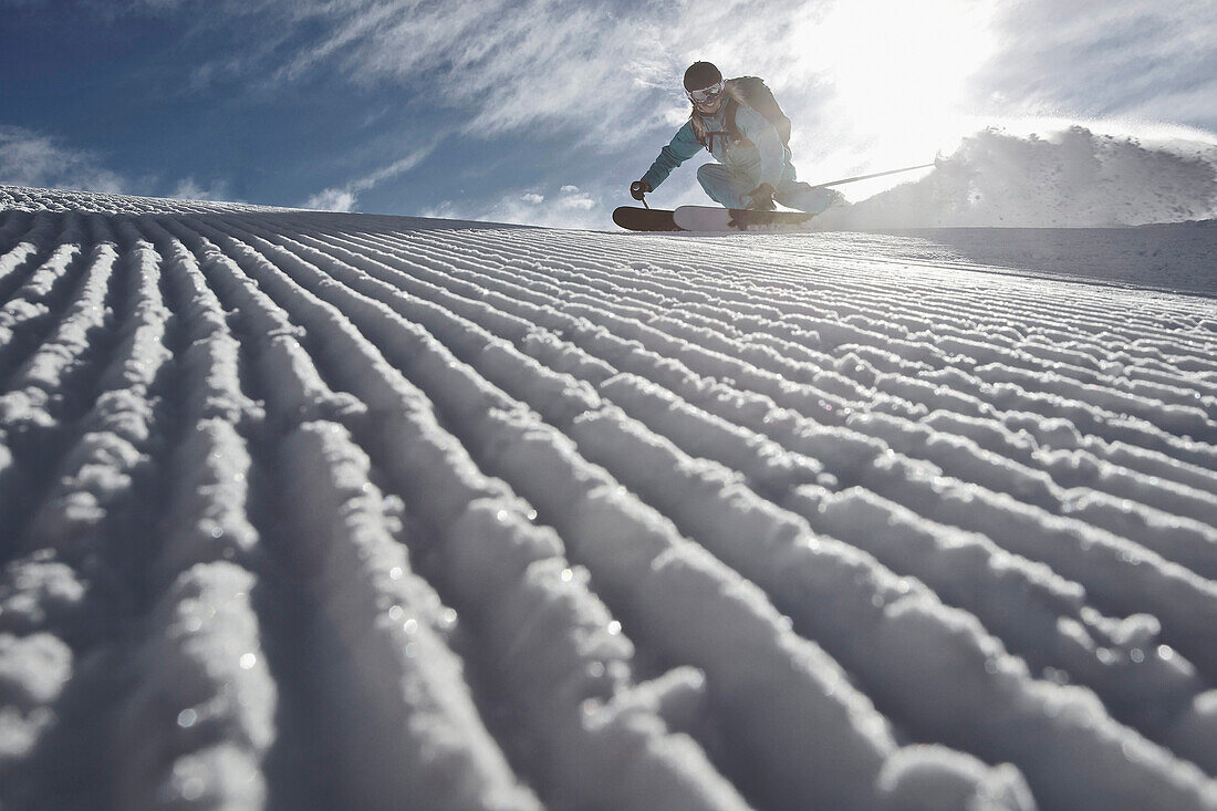 Female skier downhill skiing, Chandolin, Anniviers, Valais, Switzerland