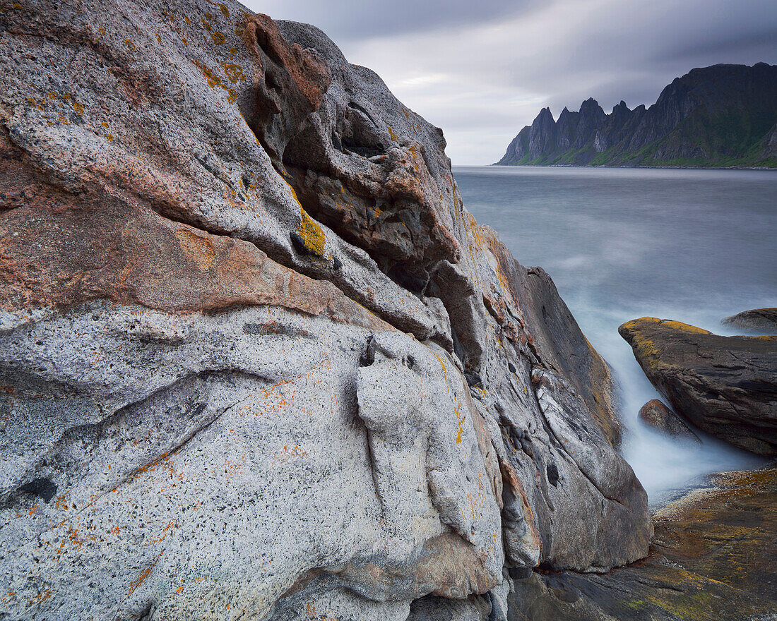 Steep and rugged mountains rising straight from the sea, Erstfjord, Senja island, Troms, Norway