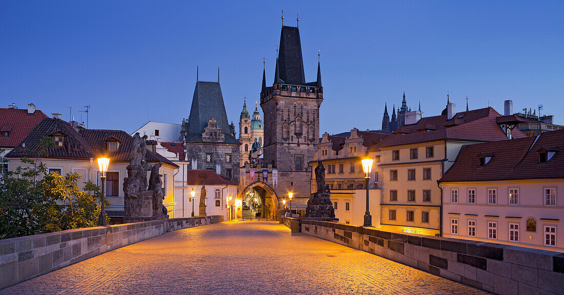 City gate on charles bridge in the evening light, Prague, Czech Republic