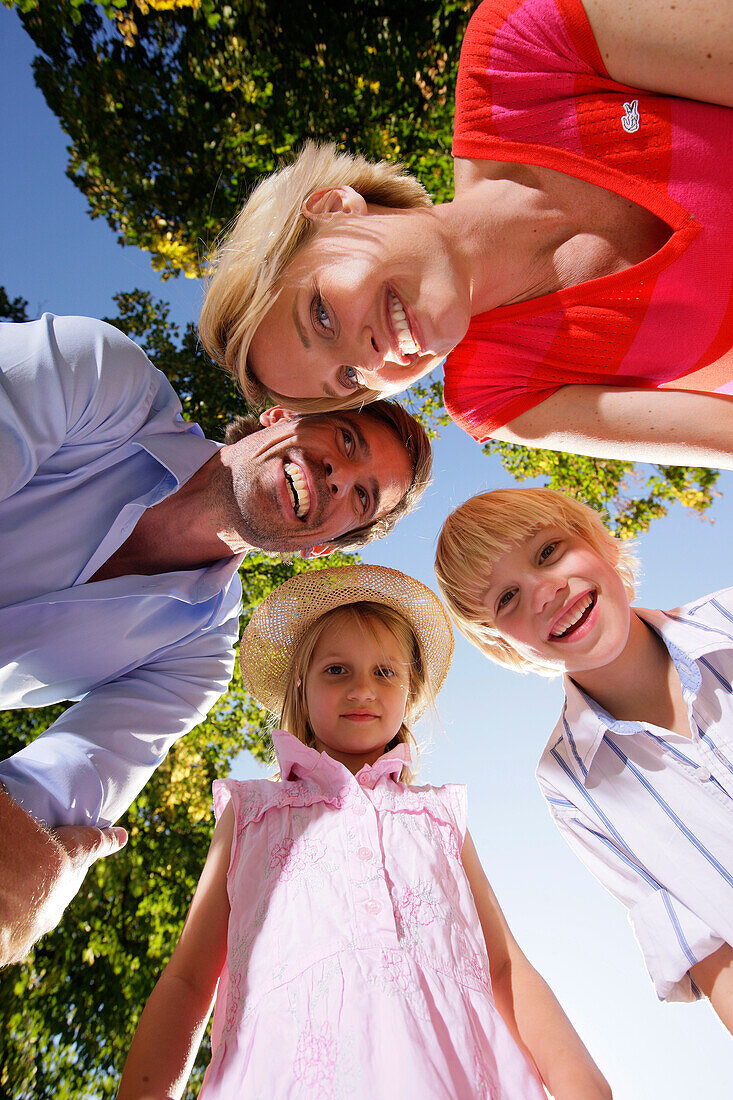 Family smiling at camera, Lake Starnberg, Bavaria, Germany