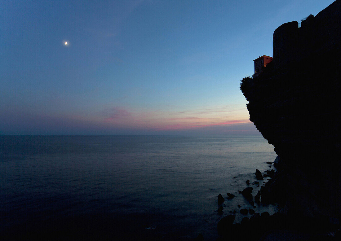Steep coast with the Mediterranean Sea, Bonifacio at dusk, Bonifacio, Corsica, France