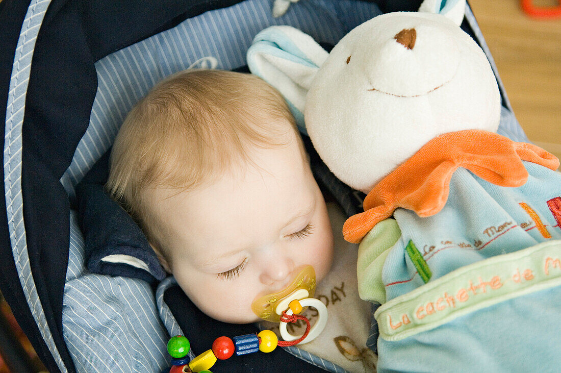 Baby sleeping, stuffed toy