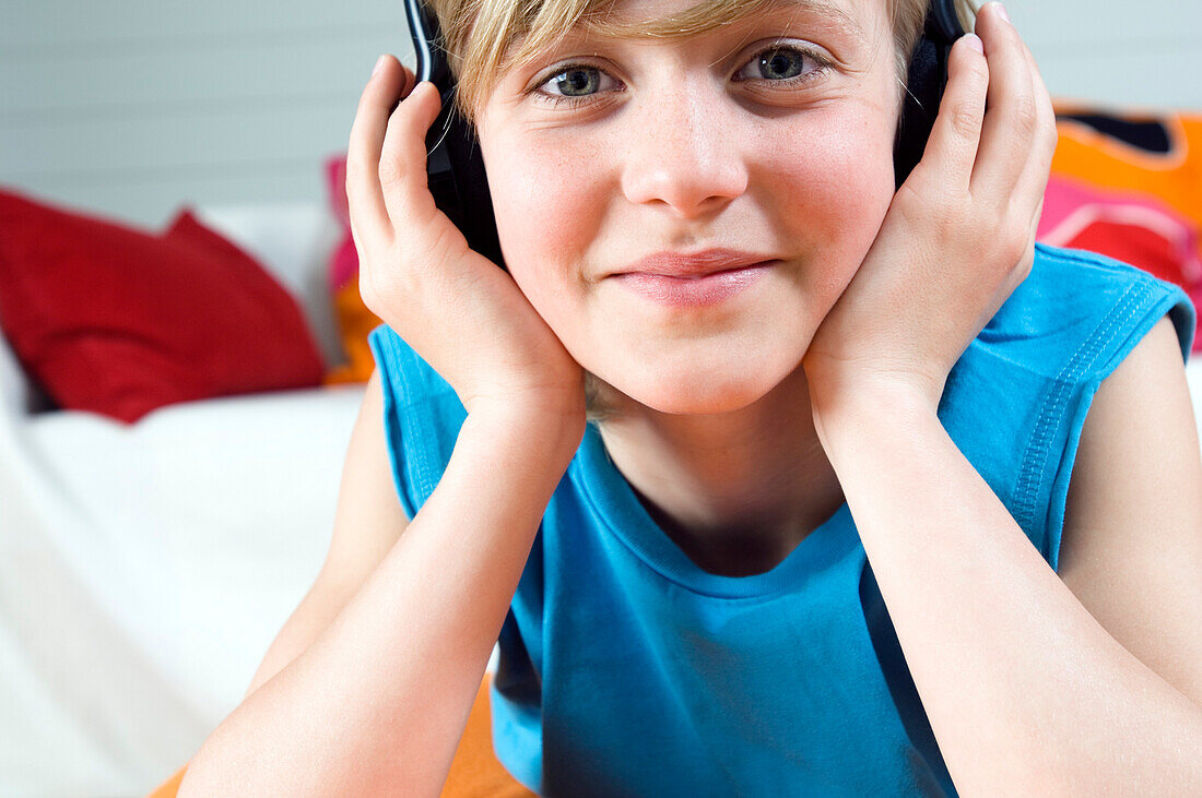 Portrait of a young boy wearing headphones