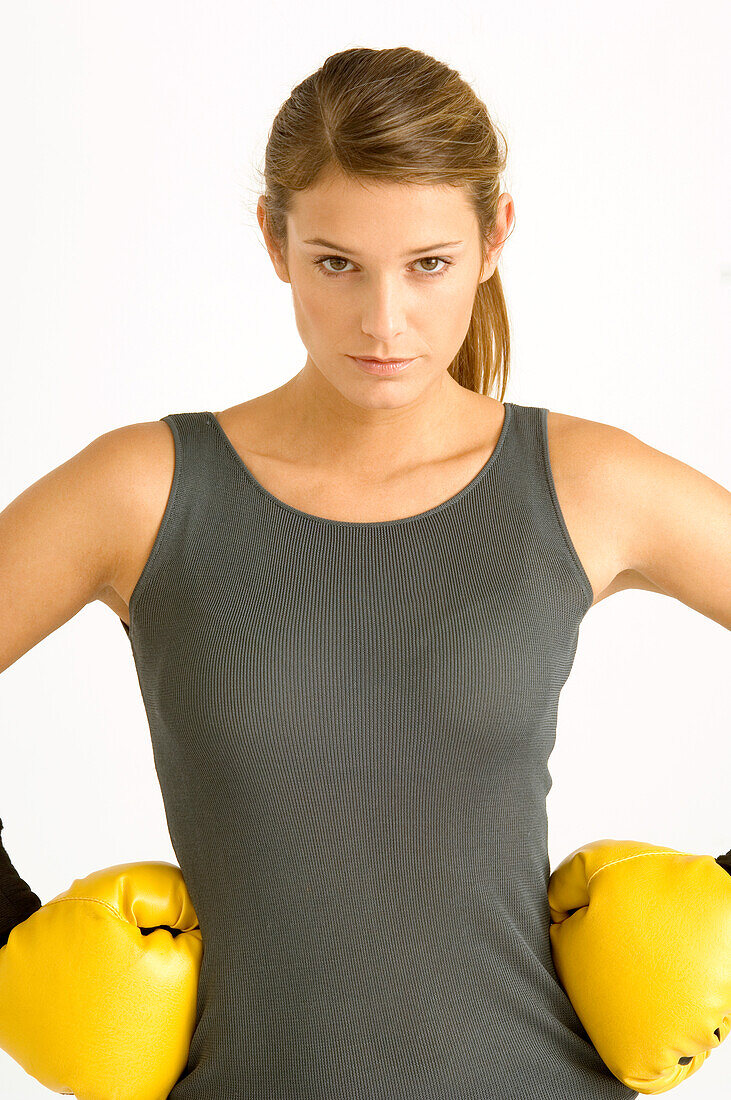 Portrait of a female boxer with arms akimbo