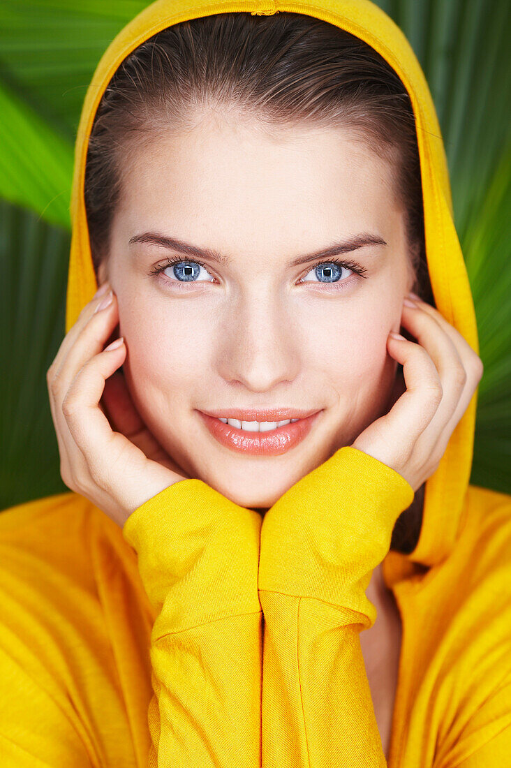 Portrait of young woman wearing hooded sweatshirt