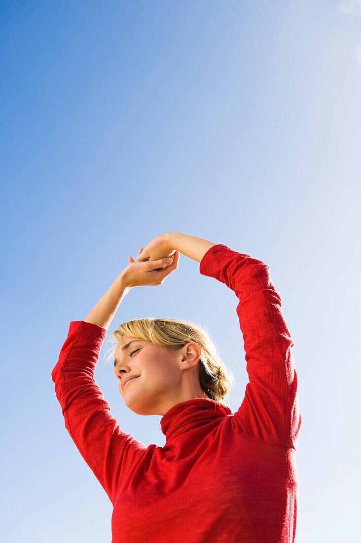 Woman stretching her arms