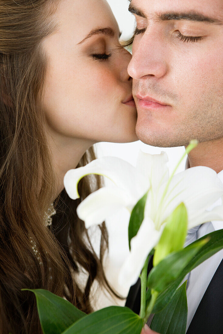 Bride kissing groom