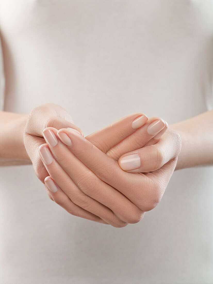 Woman with hands cupped, close-up